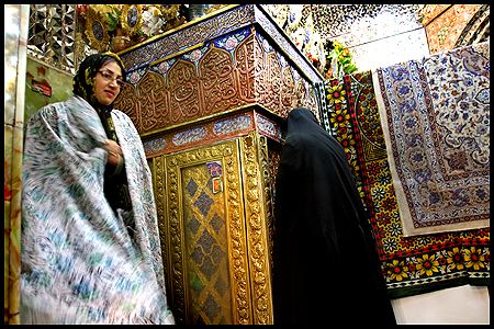 A woman praying at the shrine of Bibi Shahrbanu