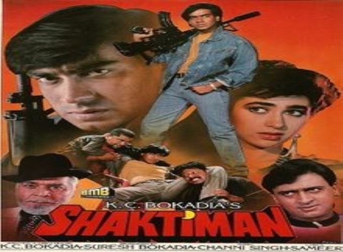 Ajay Devgn holding a rifle with Karisma Kapoor, Mukesh Khanna, and Ajit Khan in the movie poster of the 1993 film, Shaktiman