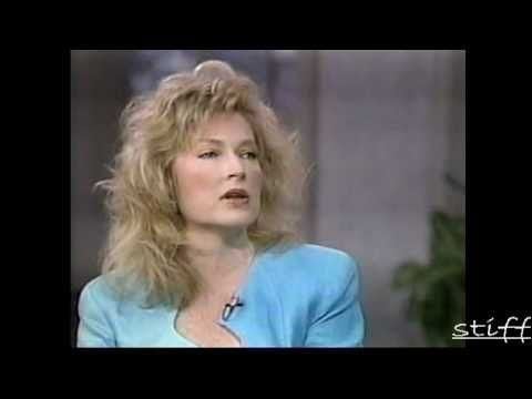 Sharon Wyatt in her curly hair while wearing light blue blouse