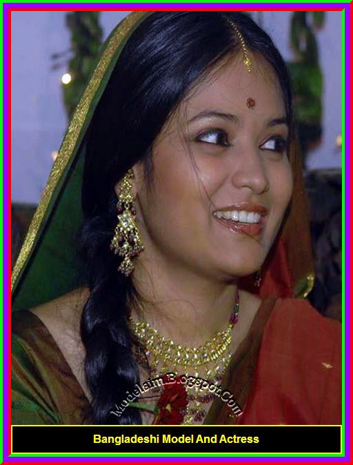 Shila Ahmed wearing traditional Indian clothing for women, earrings, and necklace.