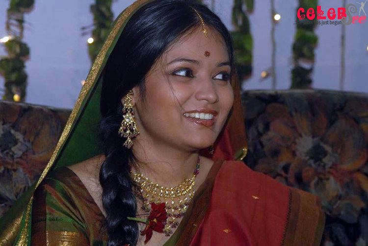Shila Ahmed wearing traditional Indian clothing for women, earrings, and necklace.