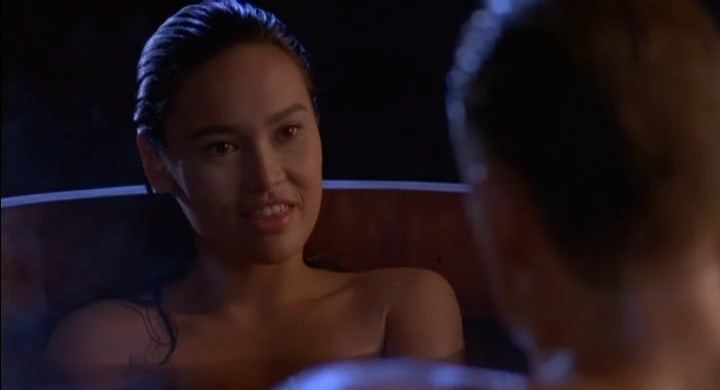 Tia Carrere talking to Dolph Lundgren in a movie scene from the 1991 film Showdown in Little Tokyo