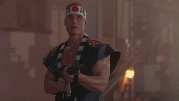 Dolph Lundgren holding a gun in a movie scene from the 1991 film Showdown in Little Tokyo