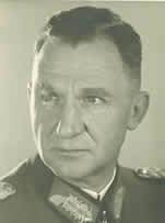 Siegfried Macholz is serious while looking to the left, has black hair, wearing an army service uniform.