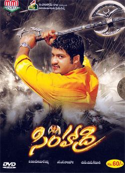 Jr. NTR holding his weapon while wearing yellow long sleeves at the DVD cover of 2003 film, Simhadri