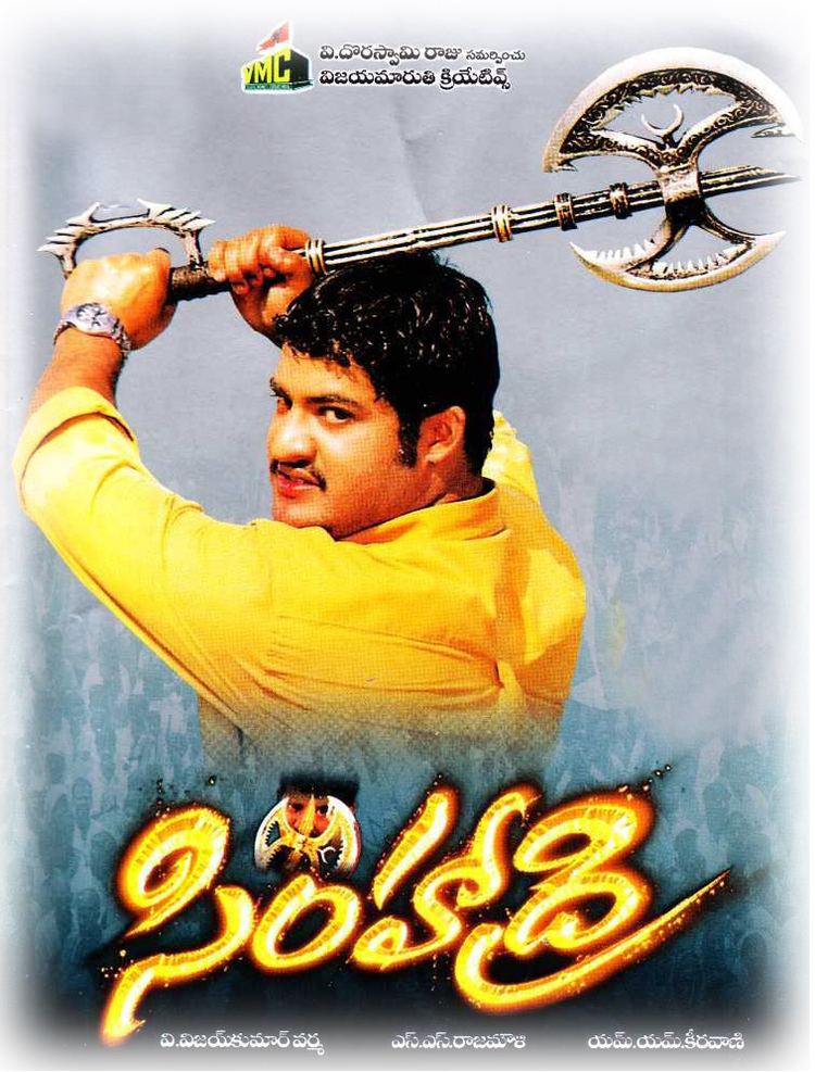 Jr. NTR holding his weapon while wearing yellow long sleeves at the  2003 film, Simhadri