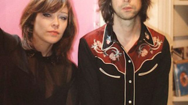Simone Butler wearing a black blouse while Bobby Gillespie wearing black, red, and yellow long sleeve