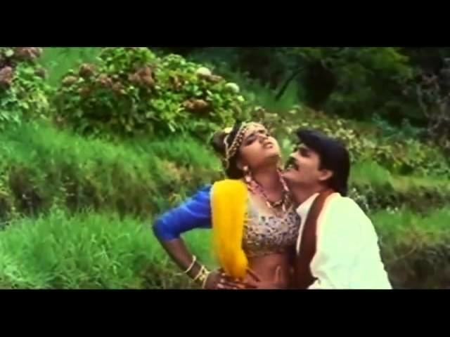Ranjith as Thirukkaval holding Rajakumari as Chinna Pulla in a scene from the 1994 movie Sindhu Nathi Poo