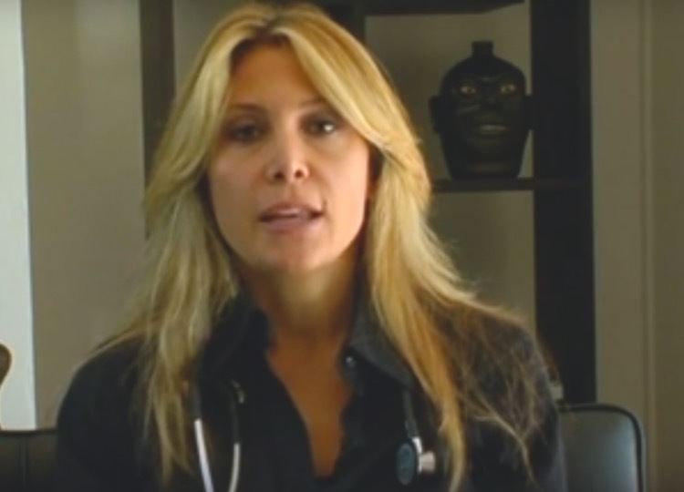 Skylar Satenstein with a stethoscope around her neck while wearing a black blouse