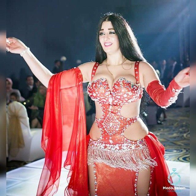 Sofinar Gourian smiling while wearing a red belly dance costume