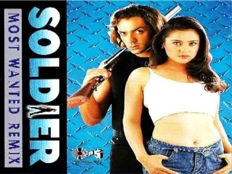 Bobby Deol holding a gun and wearing a black shirt while Preity Zinta wearing white top and jeans