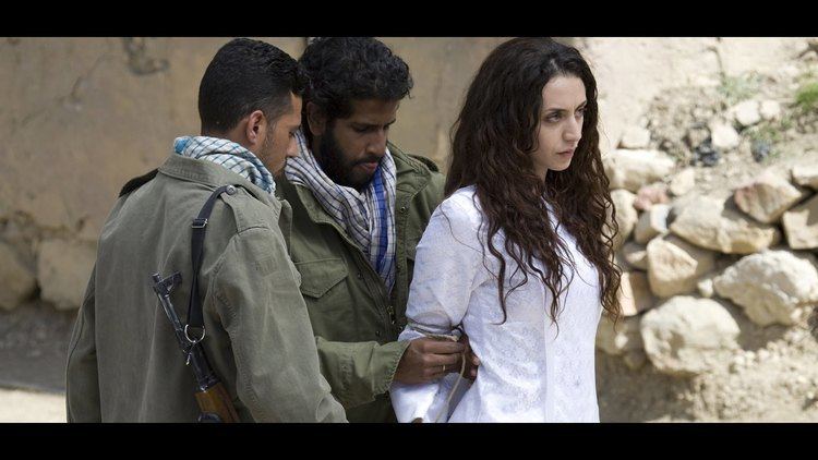 Mozhan Marnò's hands tied by the two men in a movie scene from The Stoning of Soraya M. (2008 film)