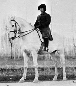 Queen Soraya Tarzi riding a white horse
