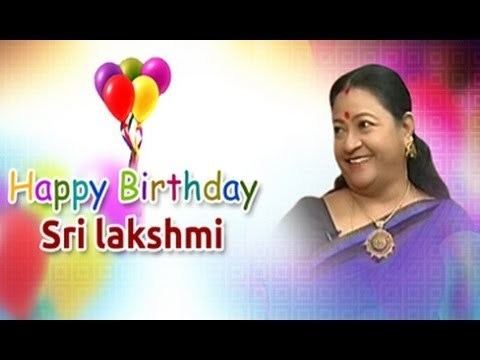 Sri Lakshmi smiling in a violet saree with balloons and a happy birthday greeting in the background