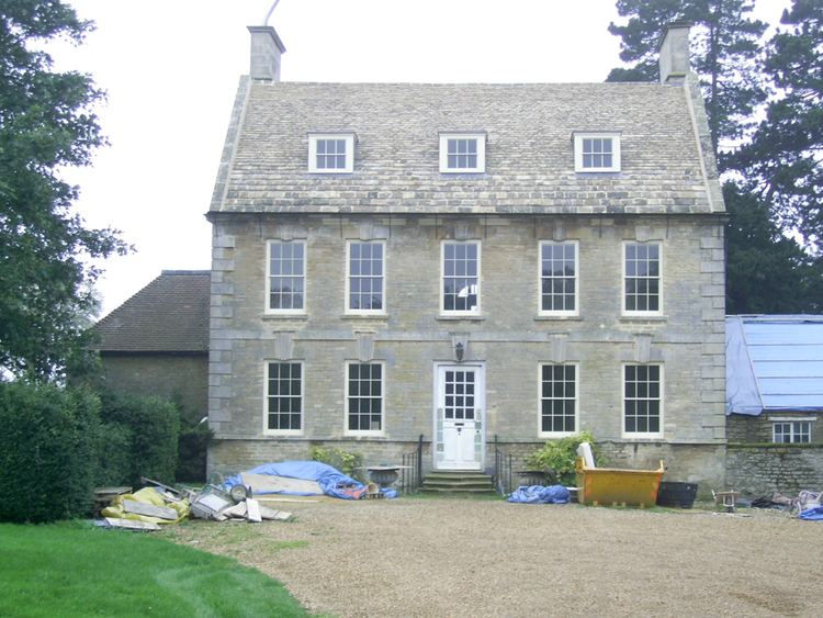 A front view of Stanwick Hall, Northamptonshire with visible building materials.