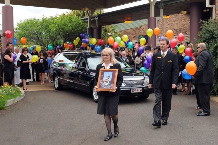 Stathi Katsidis Mourners look on as the body of Queensland jockey Stathi