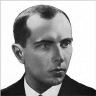 A sketch of Stepan Bandera looking serious in a white background, wearing a white shirt under a black coat and a black necktie