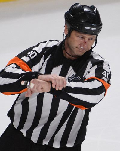 Steve Kozari NHL referee takes puck to the face stays in game Slam sports blog