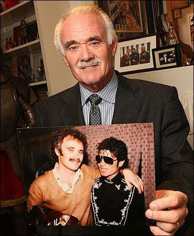 Steven Hoefflin holding a picture of Michael Jackson with him