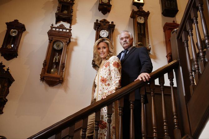 Steven Hoefflin with his wife Pamela in front of his collection of antique clocks in their Bel Air home