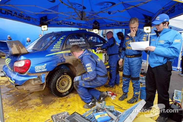 Subaru World Rally Team Subaru World Rally Team mechanics working on the Impreza WRC at