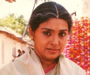 Sujatha wearing a shawl with square pattern