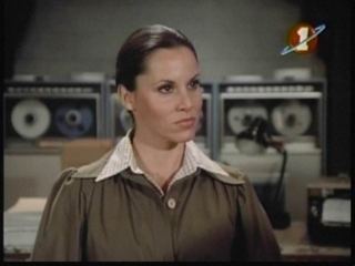 Suzanne Charny wearing brown blouse
