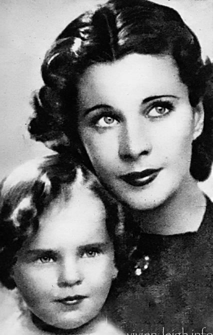 Young Suzanne Farrington and Vivien Leigh with serious faces while looking above and both are with wavy short hair. Young Suzanne is wearing a white shirt while Vivien is wearing a black top.