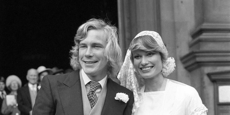 James Hunt smiling while posing for a picture-taking shortly after marrying model Suzy Miller at Brompton Oratory, London