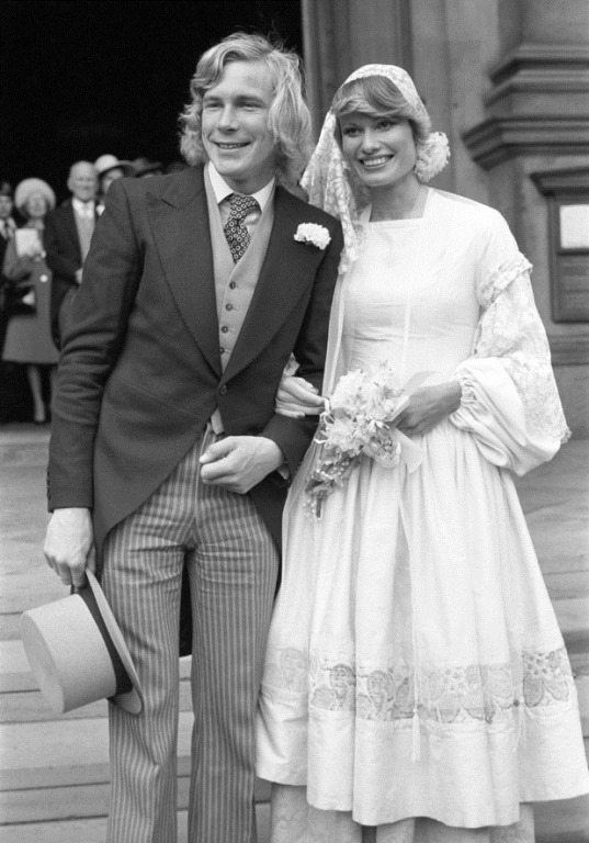James Hunt smiling while posing for a picture-taking shortly after marrying model Suzy Miller at Brompton Oratory, London