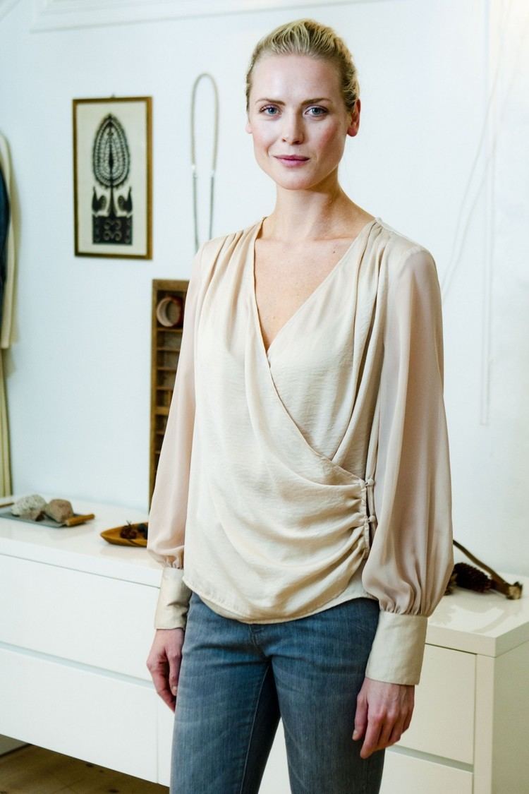 Synnøve Macody Lund wearing a cream long sleeves blouse