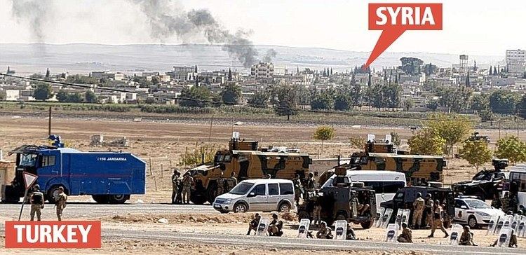 Syria–Turkey border Tanks mass as ISIS flag is raised in Syrian town just one mile away