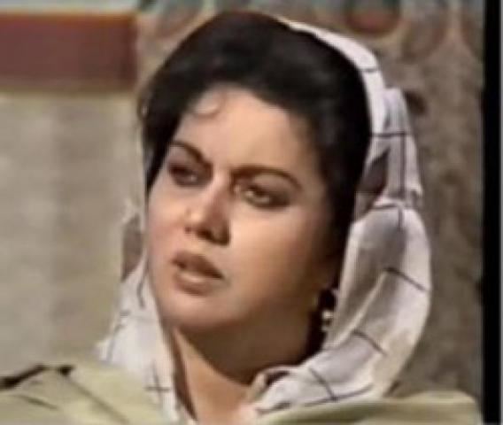 Tahira Wasti with a serious face and wearing a scarf.