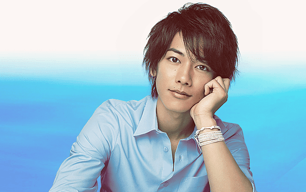 Takeru Satoh smiling while wearing a blue long sleeves and necklace