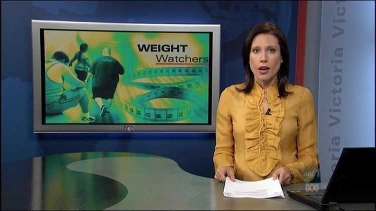 Tamara Oudyn at work as a news presenter in her yellow outfit