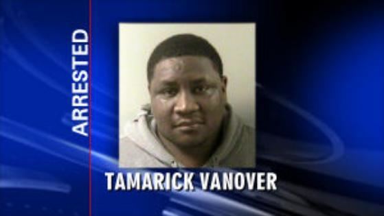 Tamarick Vanover looking serious in a gray jacket as flashed in a news arrested for assault