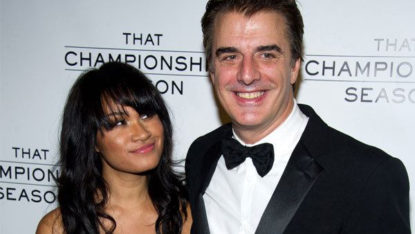 Tara Lynn Wilson smiling and looking at Chris Noth who is wearing black coat, white long sleeves and bow tie