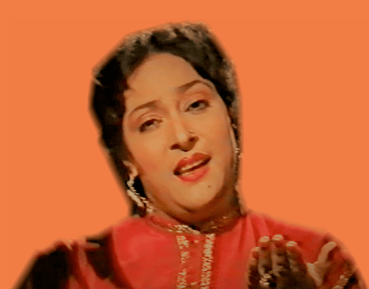 Tassawar Khanum singing in a video while wearing a red dress and some gold earrings.