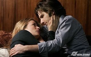 Adam Scott and Sonya Walger's intimate scene from Tell Me You Love Me, a 2007 American cable television drama series. Adam is wearing gray long sleeves while Sonya is wearing a black long sleeve top in a scene.