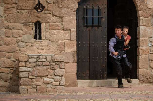Terrier Stricken movie scenes This photo provided by Open Road Films shows Sean Penn left as Jim Terrier and Jasmine Trinca as Annie in a scene from the film The Gunman opening 