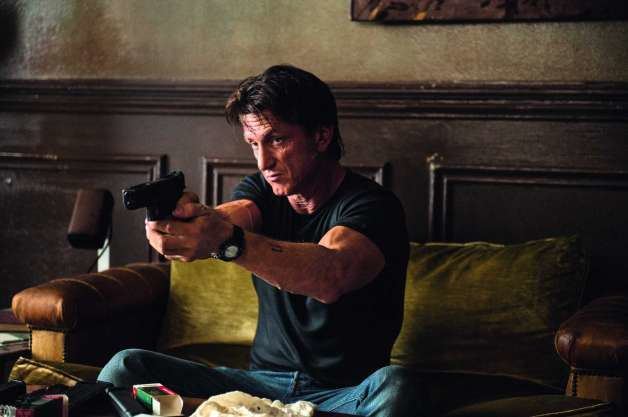 Terrier Stricken movie scenes This photo provided by Open Road Films shows Sean Penn as Jim Terrier in a scene from the film The Gunman opening in theaters on Friday March 20 