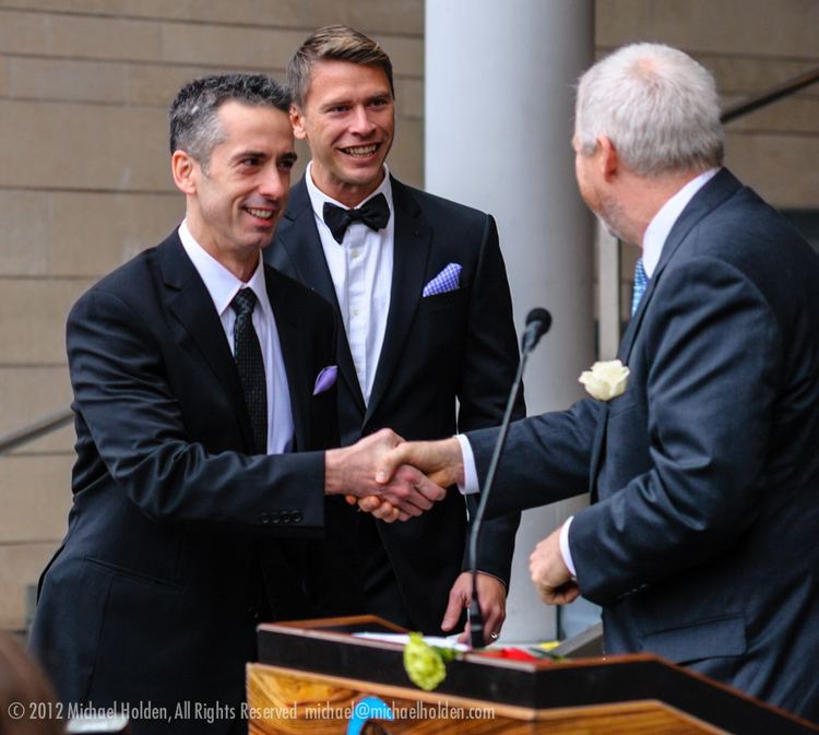 Terry Hecker Newlyweds Terry Hecker and Dan Savage shake hands with May Flickr