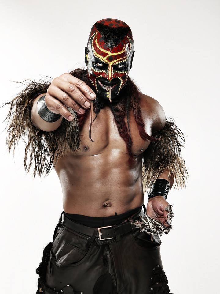 Martin Wright, also known by the ring name "The Boogeyman", topless, wearing red and yellow paints, black pants, and a black belt with hair on his arms and neck.