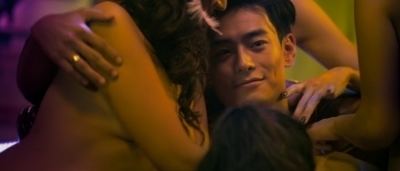 A scene from "The Gigolo", a 2015 Hong Kong erotic drama film featuring Dominic Ho surrounded by naked women.