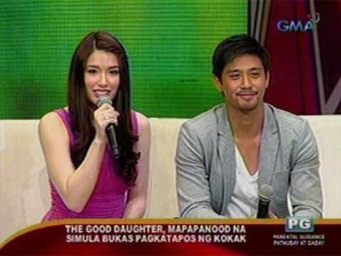 Kylie Padilla and Rocco Nacino smiling while sitting on the couch during an interview