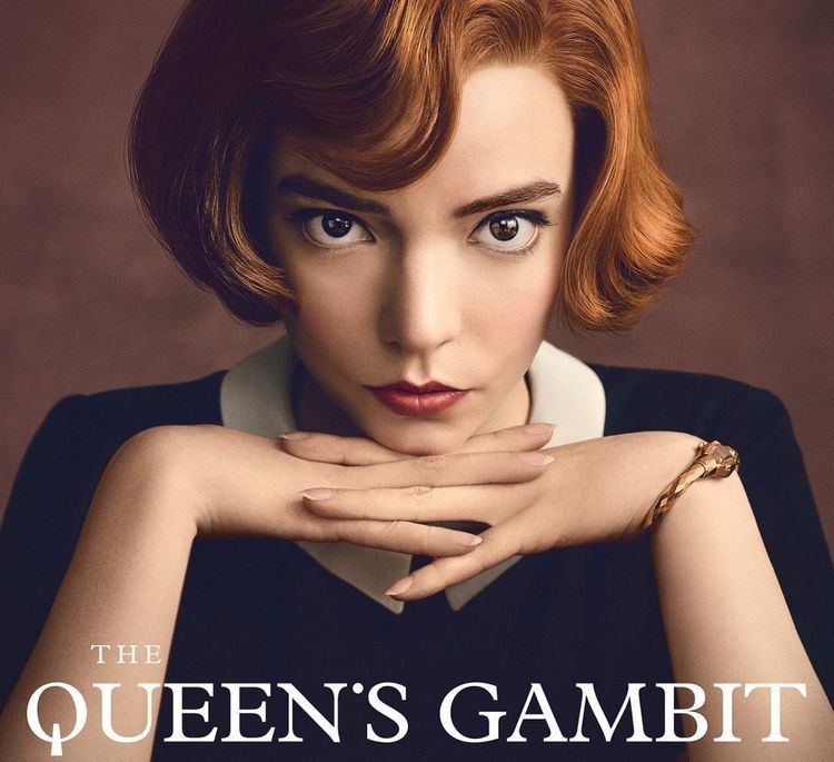 Movie poster of The Queen's Gambit starring Anya Taylor-Joy as Beth Harmon, with a fierce look while her hands are on her chin, with short blonde hair, and wearing a black and white blouse.