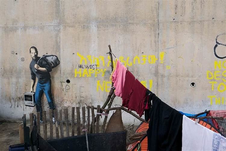 The Son of a Migrant from Syria Banksy Paints 39Son of a Migrant From Syria39 Steve Jobs at Refugee