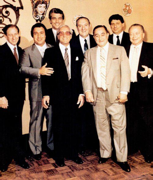 Thomas Bilotti smiling with Tommy Gambino, Joe Butch Corrao, Joe Brewster delmonico, Paul Castellano, Frank D'Apolito, Frank Deccico, and James Failla