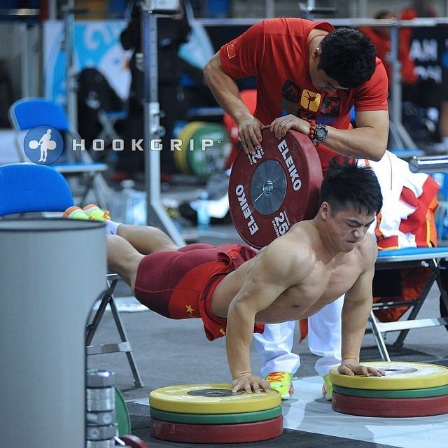 Tian Tao Tian Tao 85kg China and Coach Yu Jie doing some sort