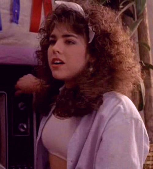 Tina Caspary with curly hair in a scene from the 1987 movie, Can't Buy Me Love